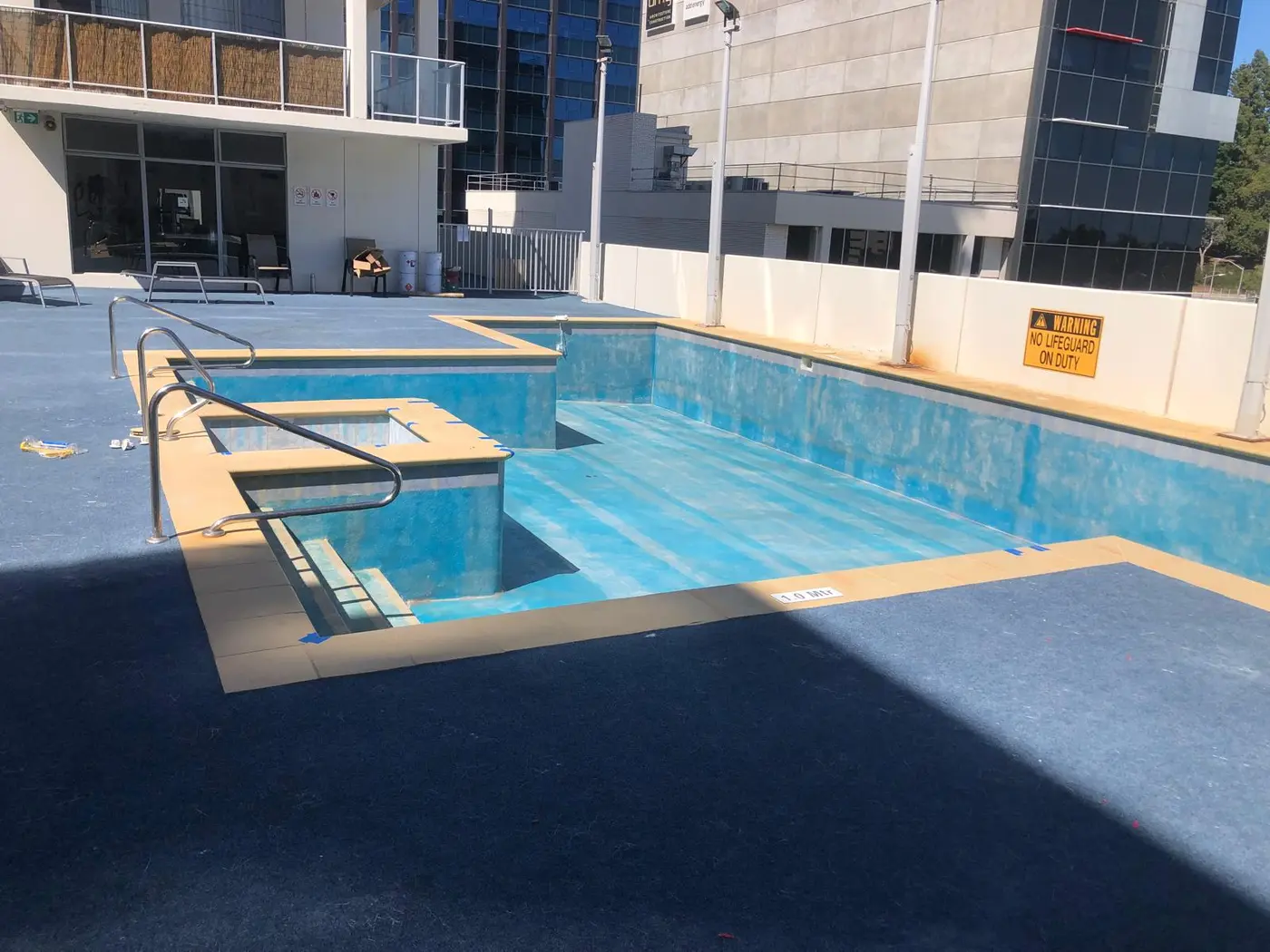 Existing large pool interior before the finished restoration coating